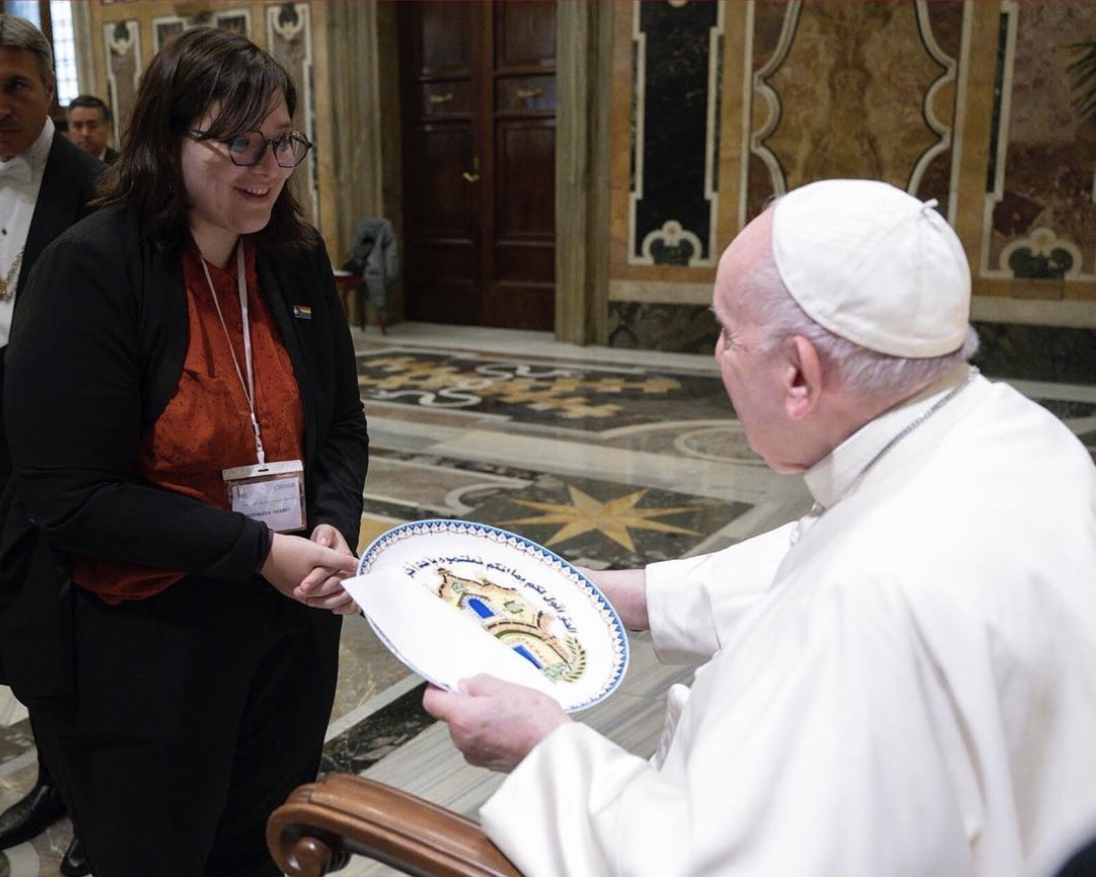 Pope Francisco receiving a gift from ECAR